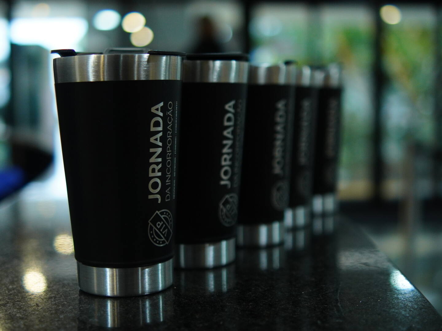 Copos personalizados da Jornada da Incorporação no kit do evento